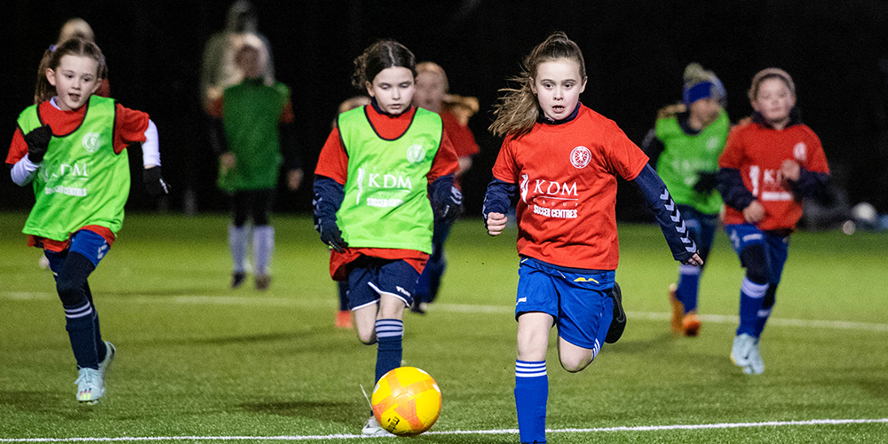 Girls playing grassroots football