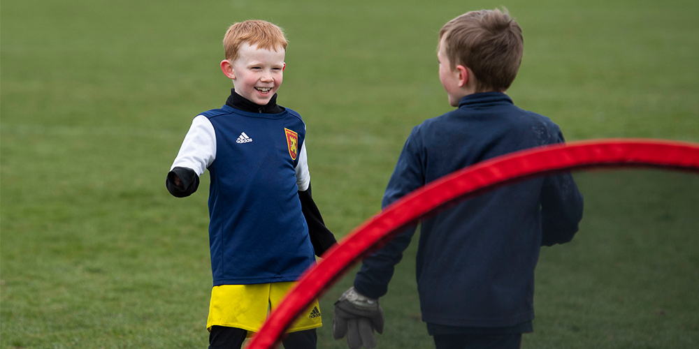 Children playing football in Scotland