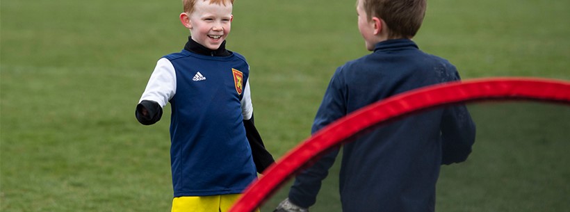Children playing football in Scotland