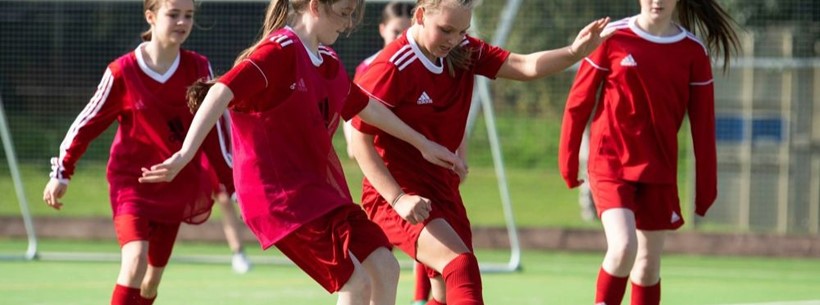 Girls playing football