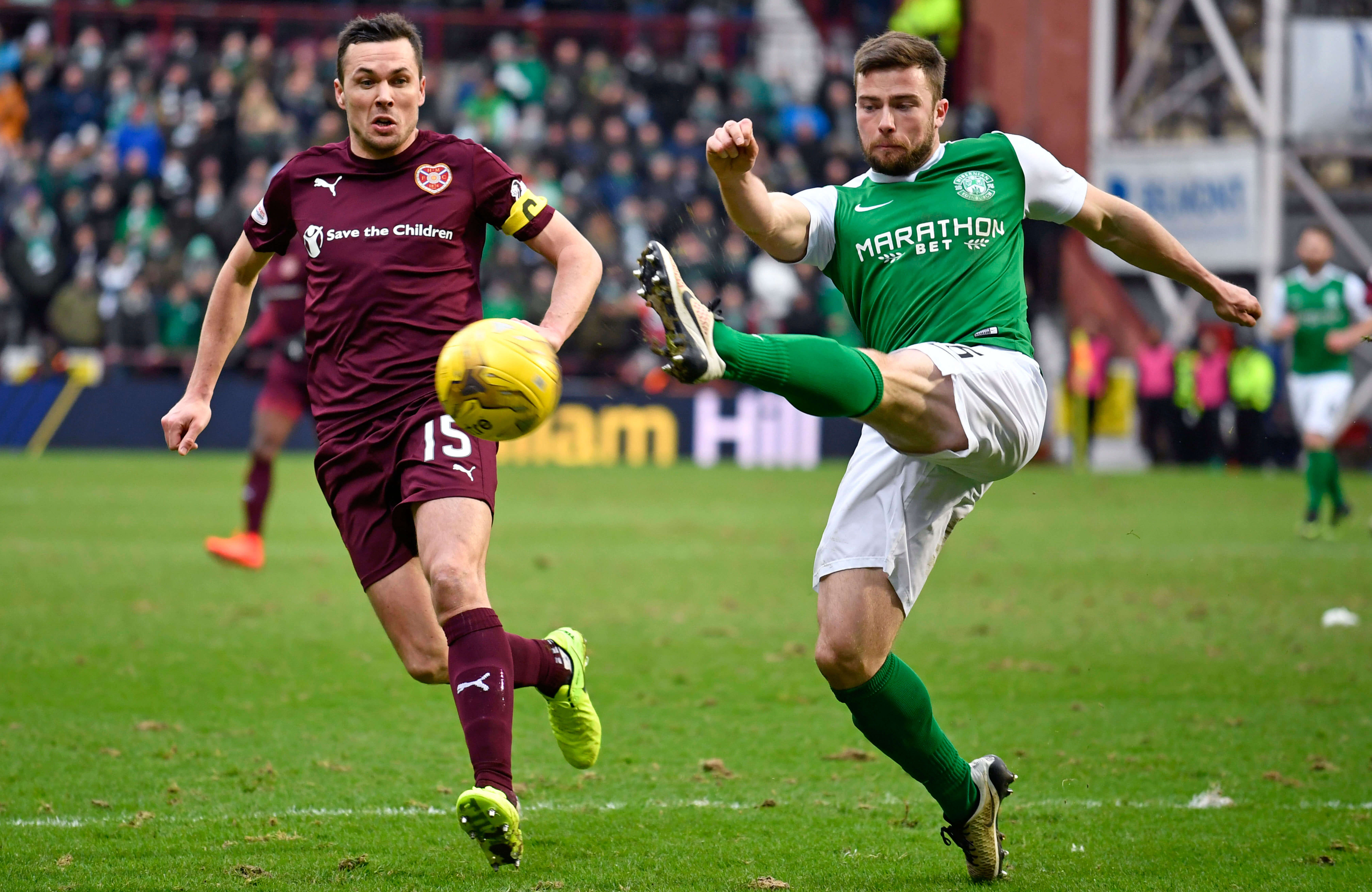 Don Cowie and Lewis Stevenson fight for possession at Tynecastle.