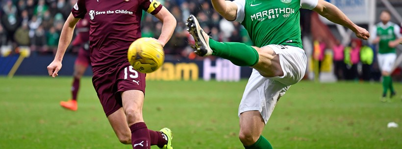 Don Cowie and Lewis Stevenson fight for possession at Tynecastle.