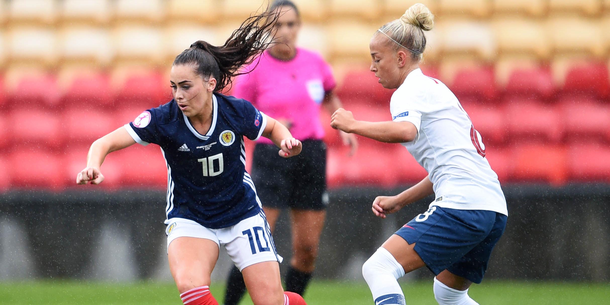 Jamie-Lee Napier fends off a Norwegian player