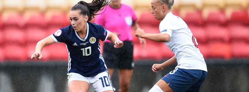 Jamie-Lee Napier fends off a Norwegian player