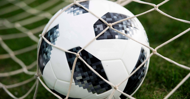 A football in back of the net